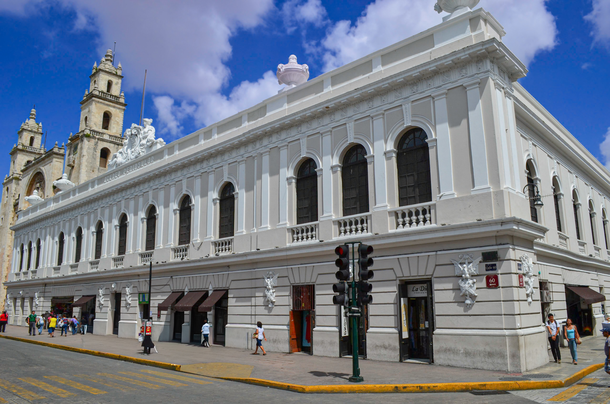 A grand, colonial building in Mérida, with an intricate facade and arched windows. The city's preserved colonial architecture offers stunning backdrops for photos and unique venues for events and receptions for MICE groups.