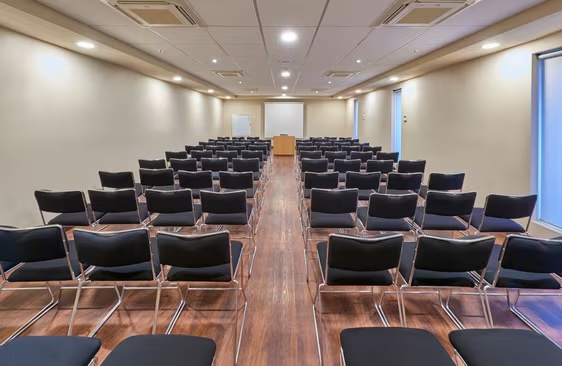Conference room at City Centro by Marriott Oaxaca with seating and AV setup, ideal for business meetings, seminars, and MICE events in Mexico.