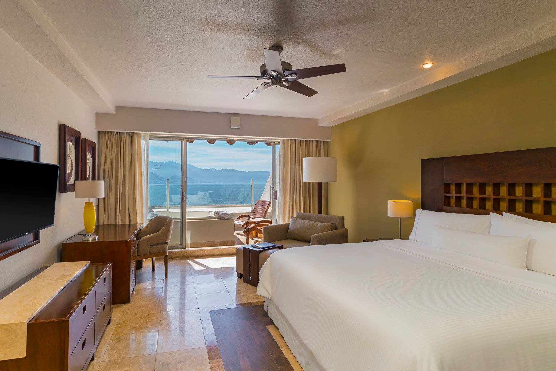 Oceanview suite at The Westin Resort & Spa Puerto Vallarta, featuring modern furnishings, work desk, and scenic views—ideal for executive stays, incentive travel, and MICE accommodations in Mexico.