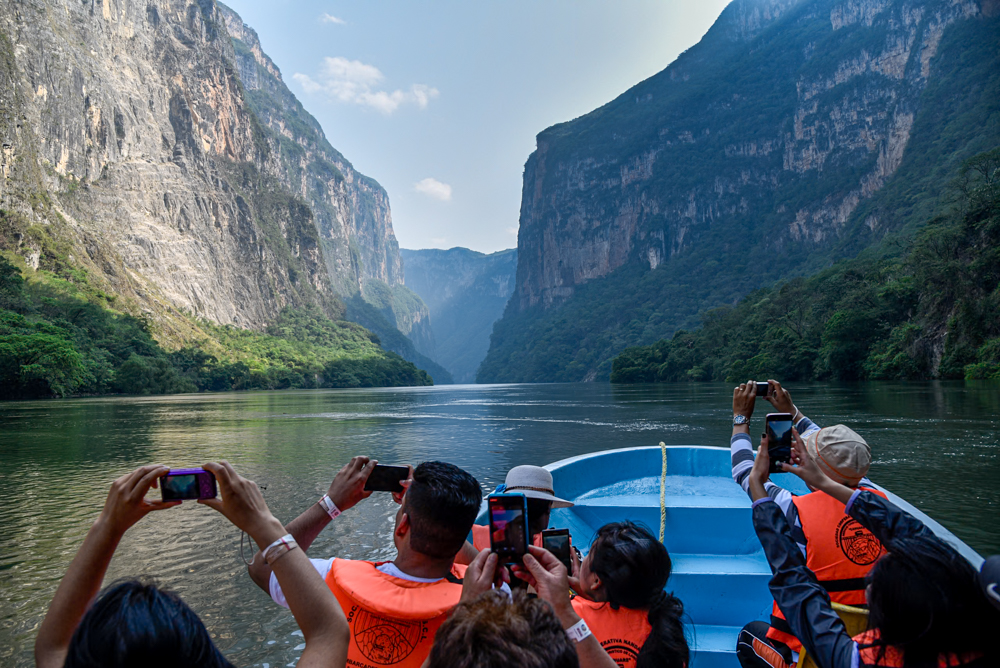 Tourists experiencing a boat trip in Sumidero Canyon, one of the most iconic attractions of Chiapas, Mexico
